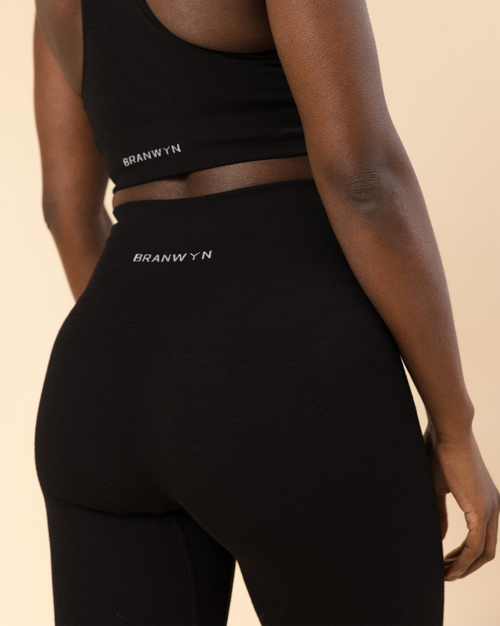 Back view of BRANWYN Essential Compressive Legging showing the supportive waistband made of Merino.