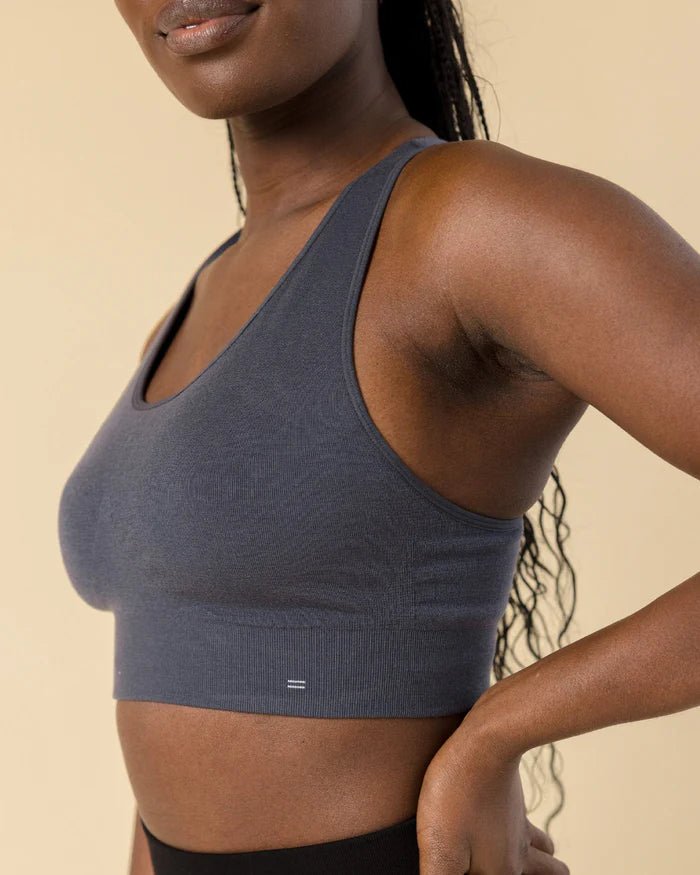 Side view of BRANWYN Essential Racerback Sports Bra, Merino sports bra in grey. Nontoxic sports bra with removable pads.