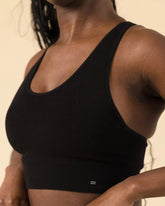 Front view of black Essential Racerback Sports Bra by BRANWYN. Merino Wool compressive bra wicks sweat and keeps you dry through hikes, skis and workouts.