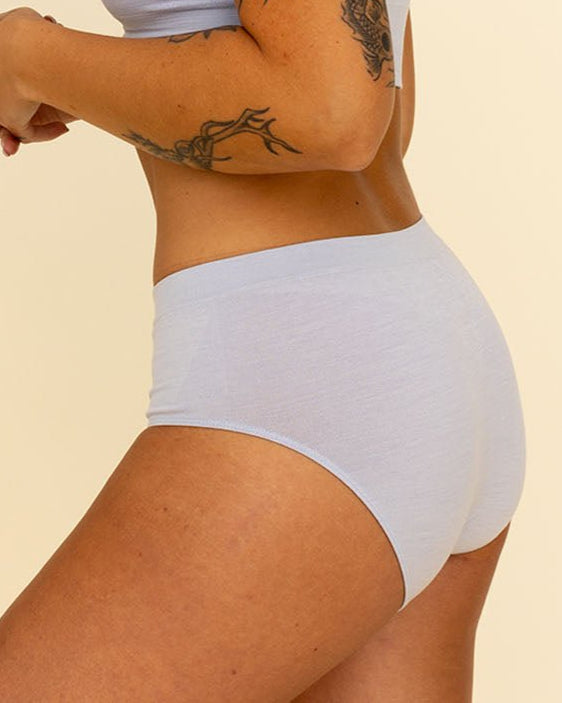 Side view of woman wearing grey high waisted Merino underwear by BRANWYN. The Essential Hipster high waisted comfortable women's panties.