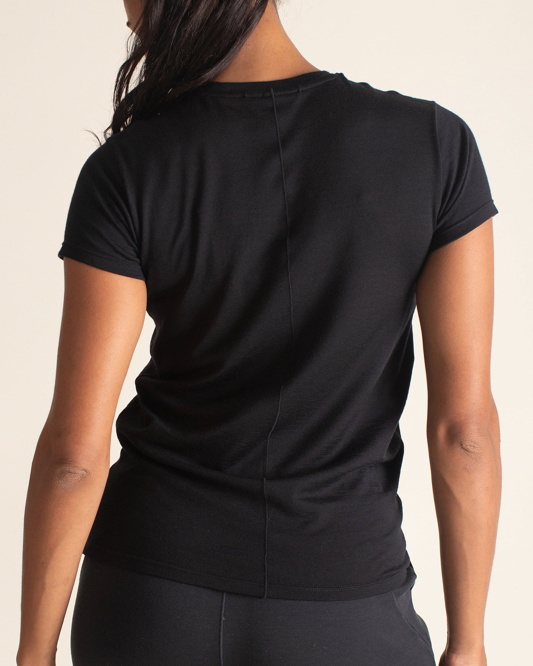 Woman wearing BRANWYN Women's Merino Wool Black Short Sleeve Tee