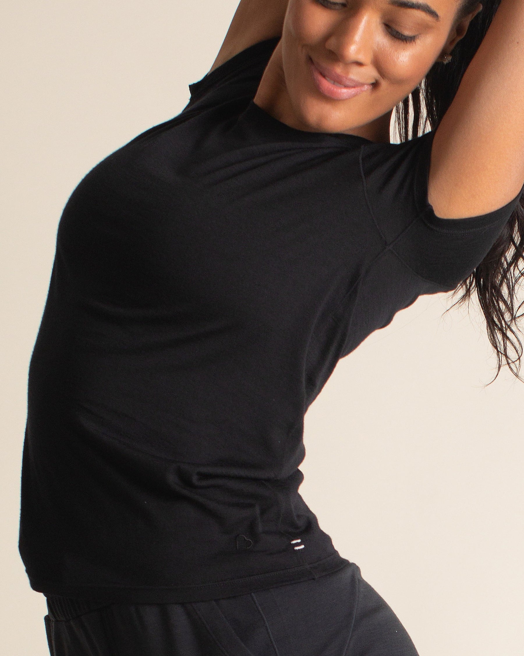 Woman wearing BRANWYN Women's Merino Wool Black Short Sleeve Tee