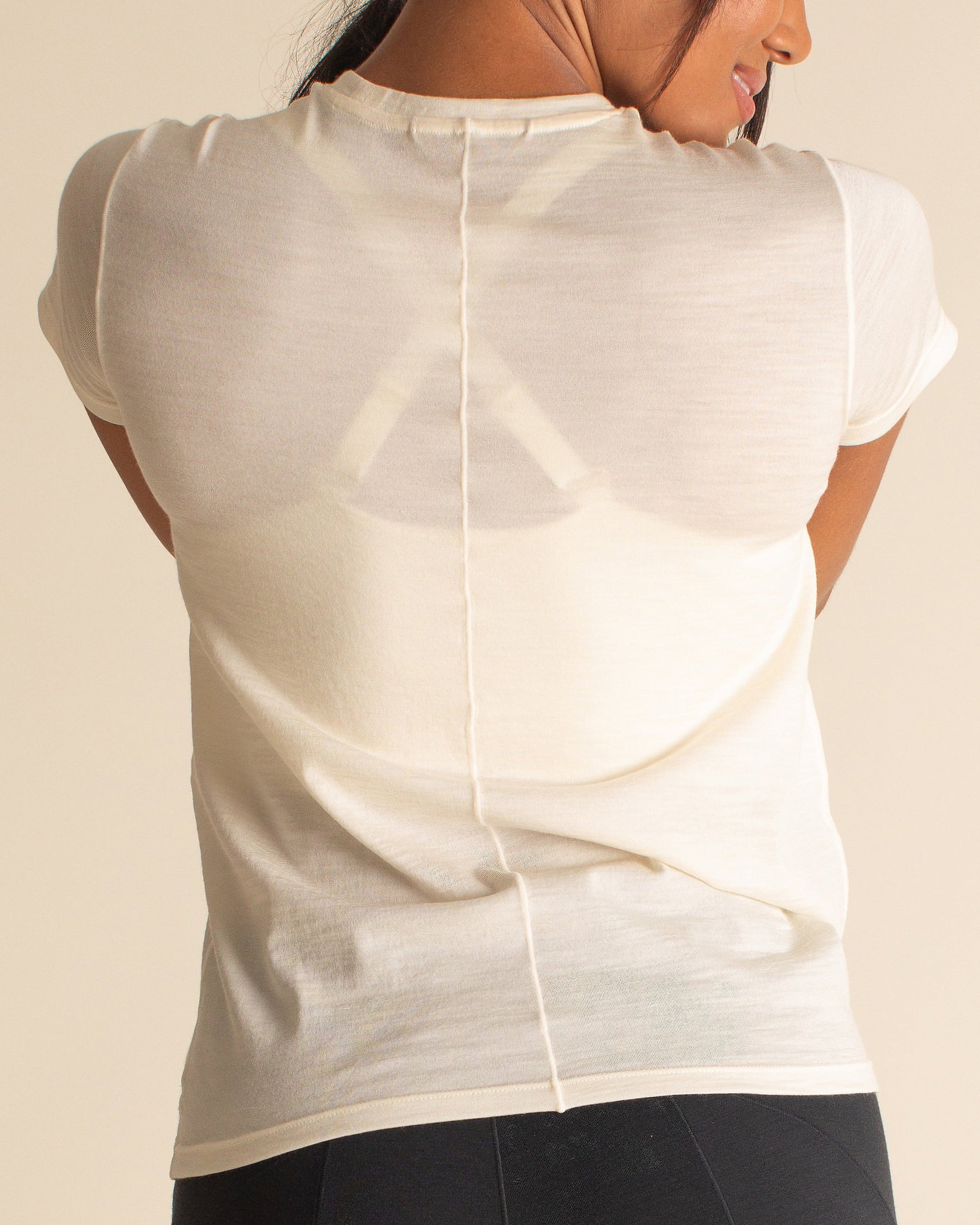 Woman wearing BRANWYN Merino Short Sleeve Tee in Natural White great for Hiking and Yoga