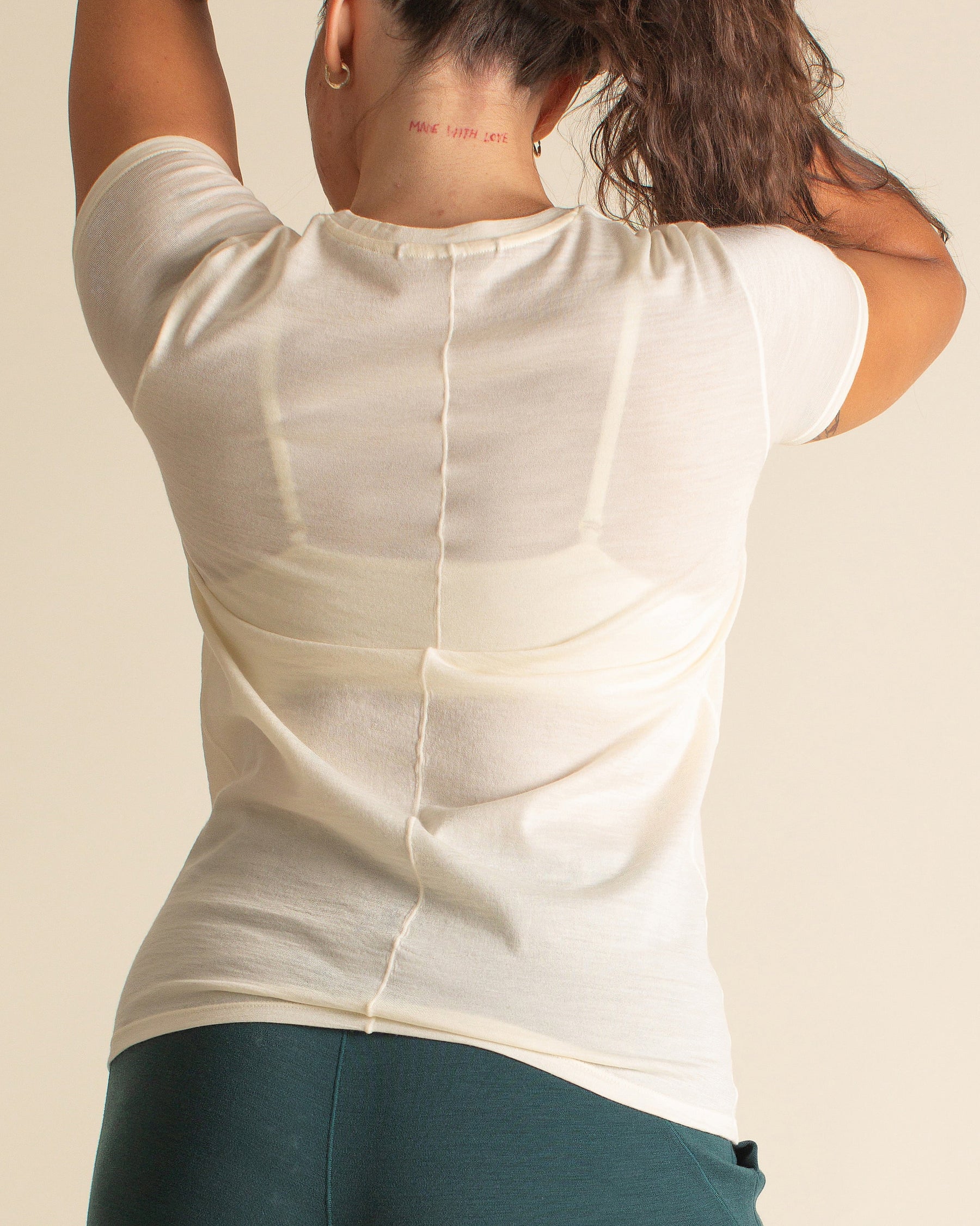 Woman wearing BRANWYN Women's Merino Wool Natural White Short Sleeve Tee