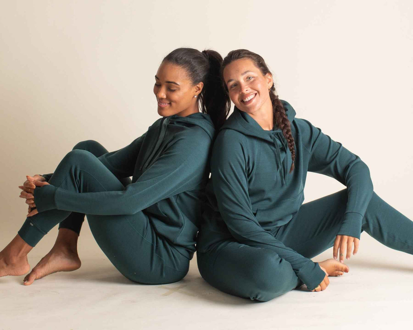Two women in Merino Athleisure hoodies and joggers