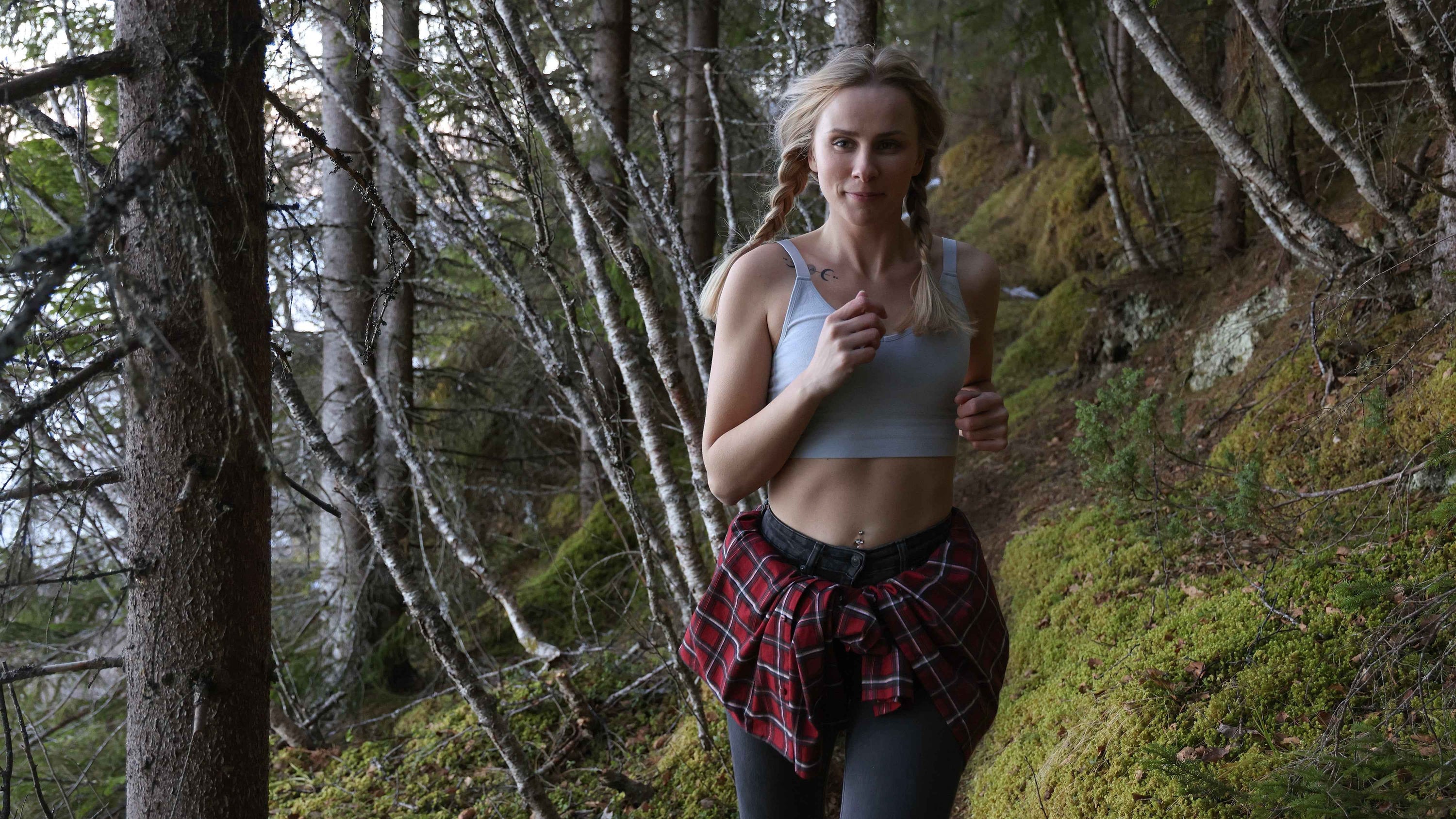 Woman in BRANWYN ZQ ethical Merino wool bra and underwear running outside