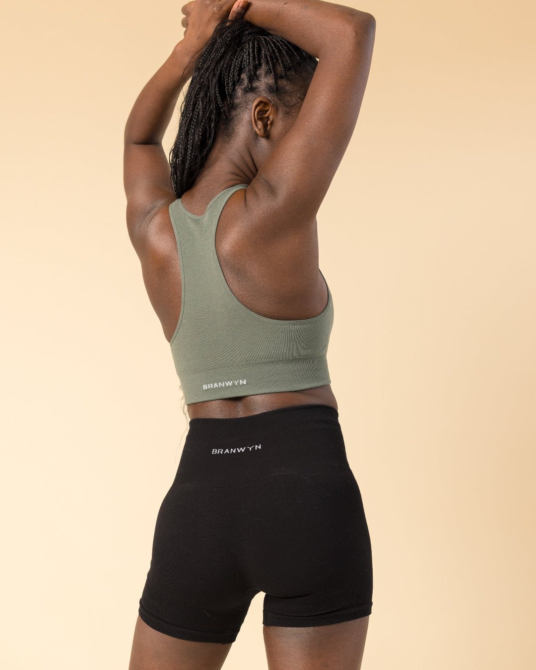 Model wear BRANWYN's Essential Compressive Shorts, a Merino wool hiking, yoga, running and bike short.