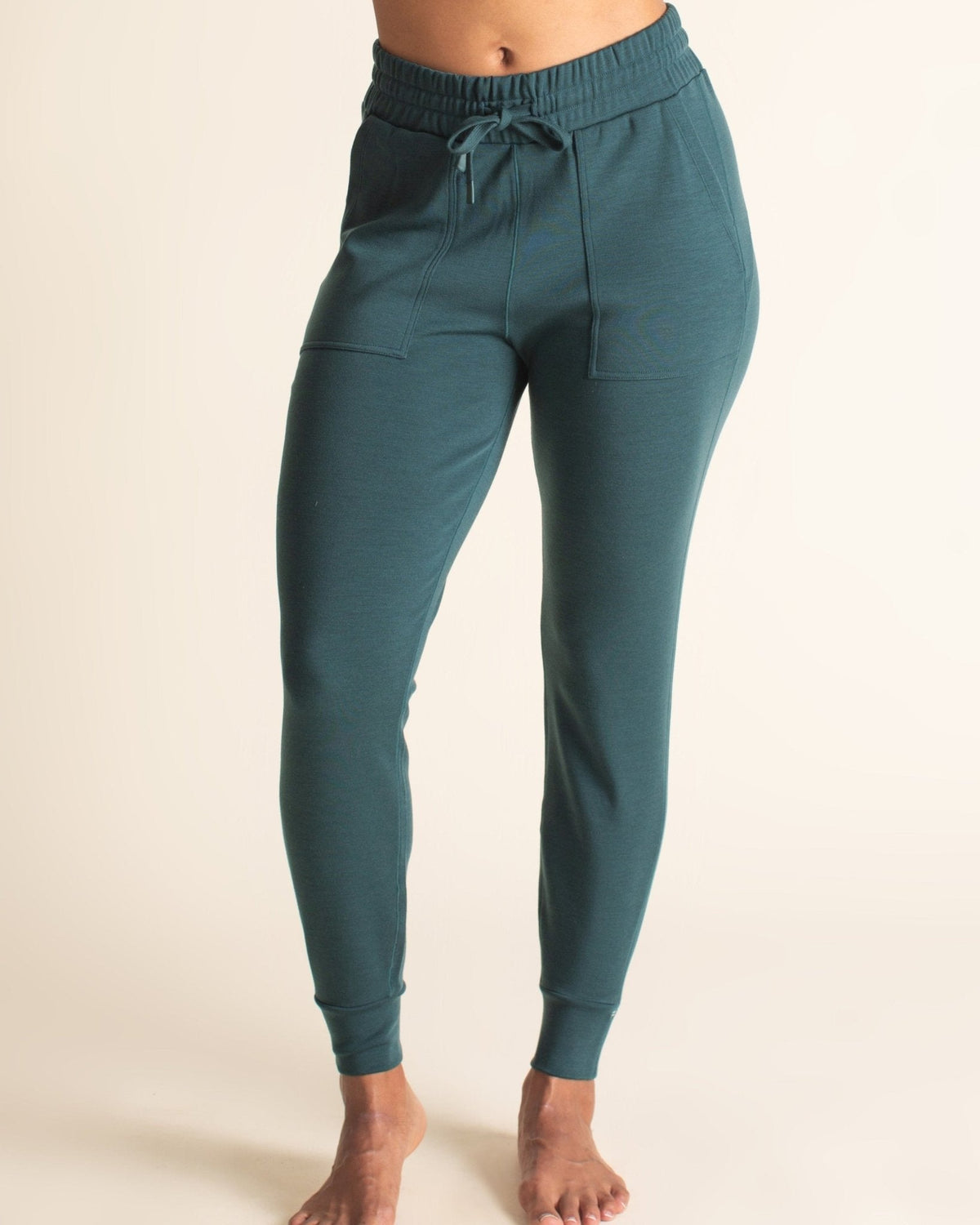 Front view of teal BRANWYN Merino wool jogger sweatpants for women. Sustainable Merino joggers made of natural fibers that are plastic free, non-toxic, and free of BPAs and PFAs.