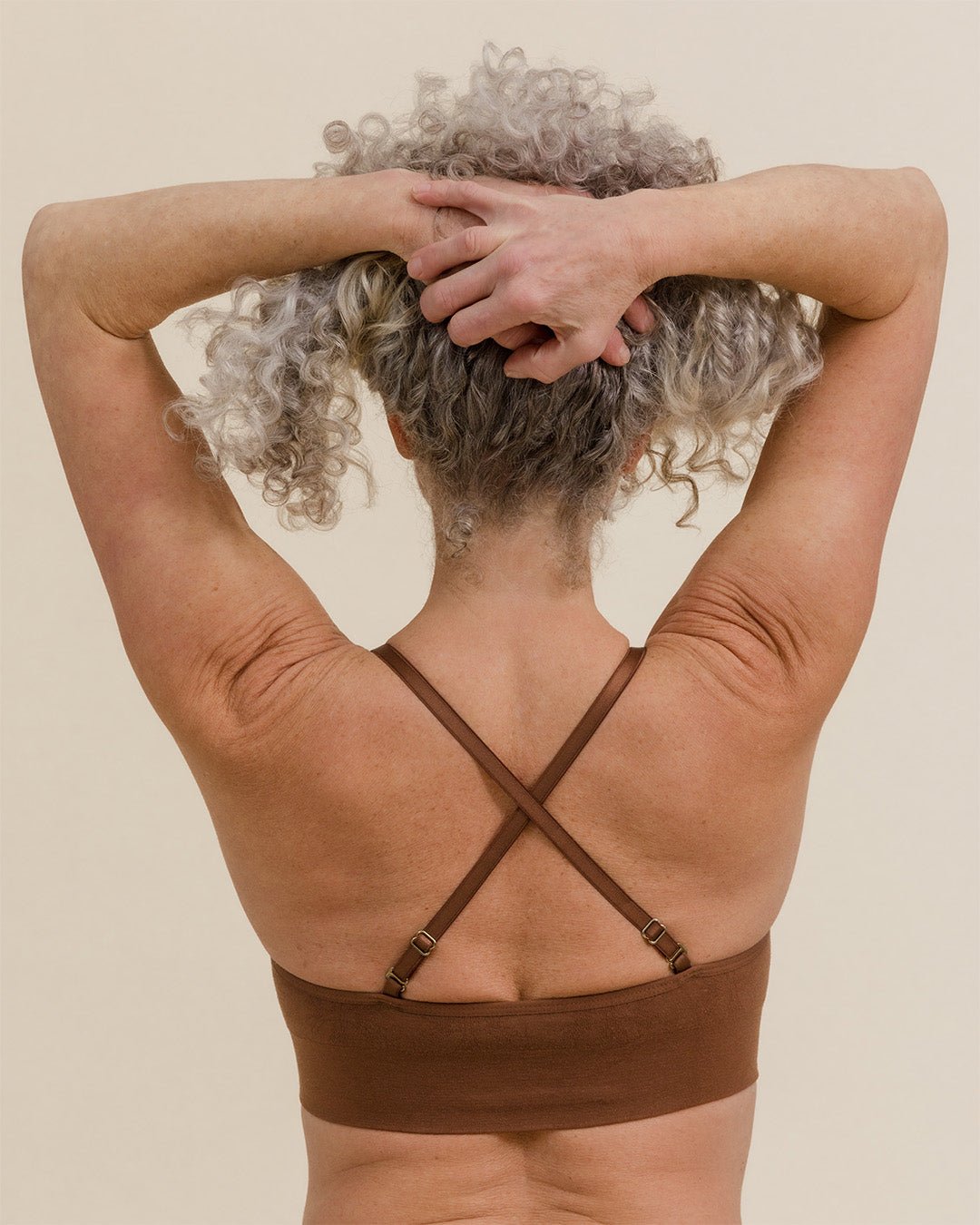 Back view of BRANWYN Essential Merino Bralette in Dark Nude, cross straps for optional racerback style.