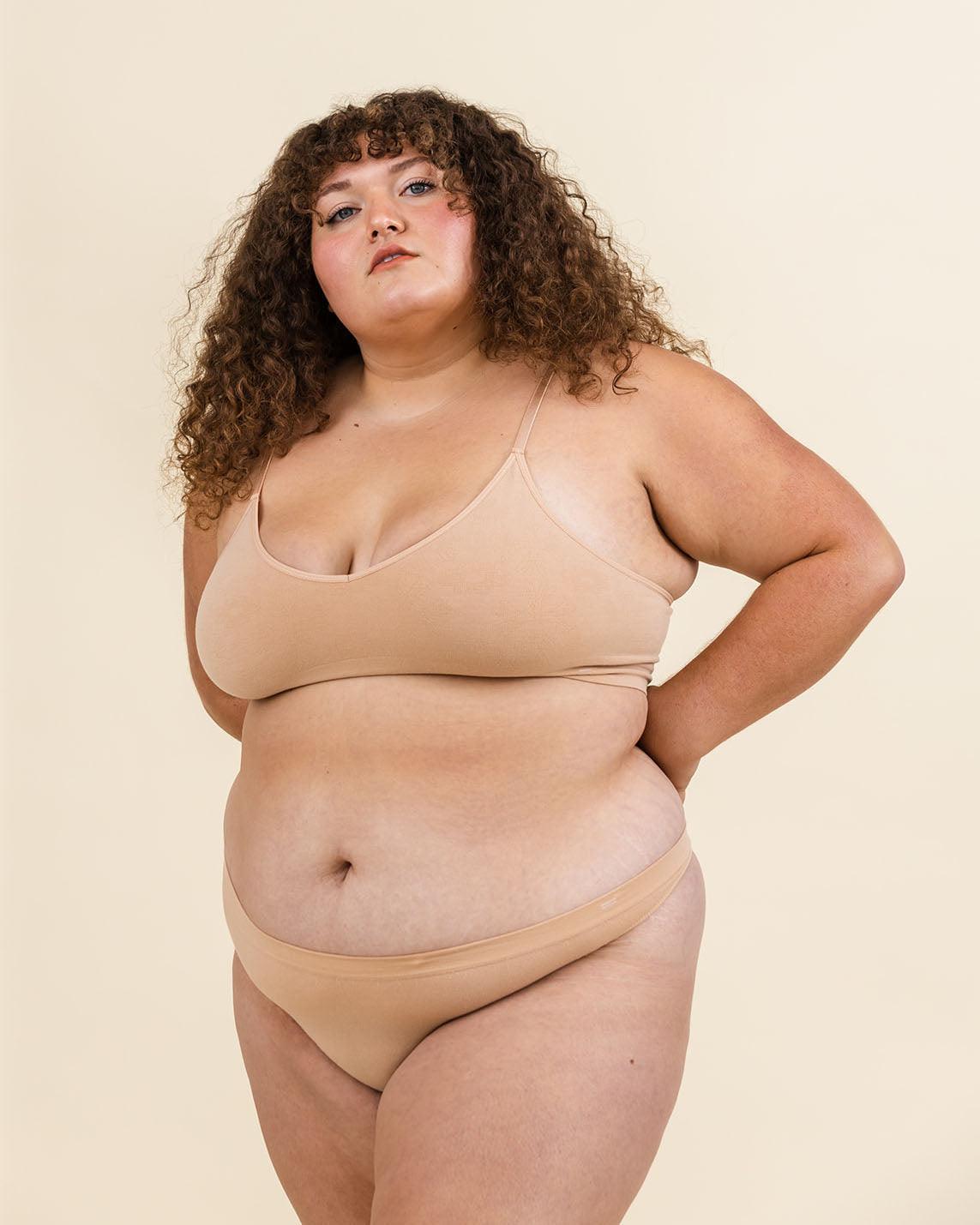 Woman wearing Merino bralette and Merino underwear set, soft seamless design for comfort.