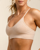 Front view of BRANWYN Essential Bralette in Light Nude, seamless ZQ Merino wool bralette.