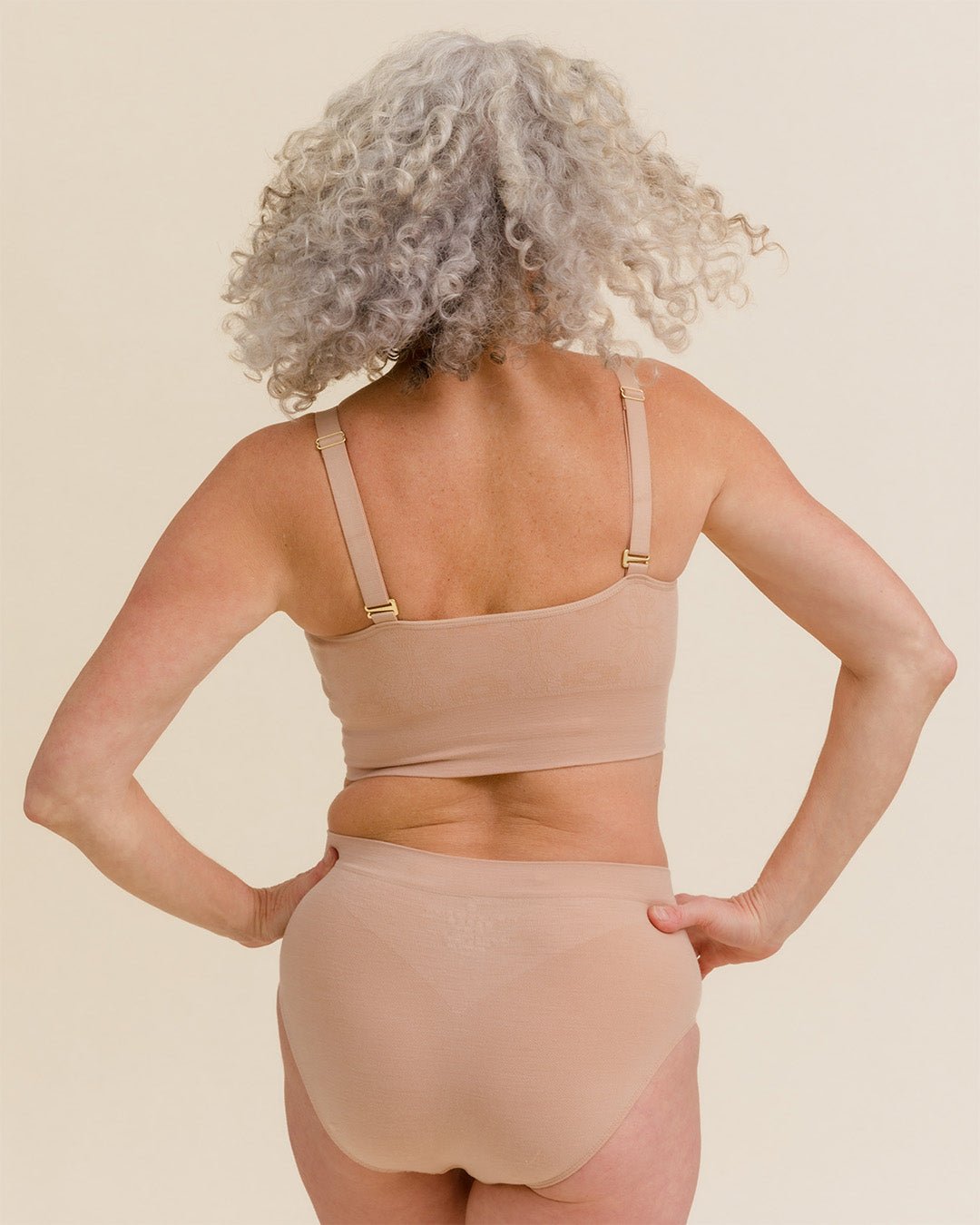Back view of Light Nude Essential Busty Bra by BRANWYN, merino bralette with supportive straps for large chested women.