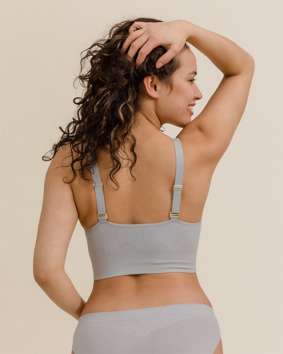 Back view of BRANWYN Essential Busty Bra in Luna Grey, seamless merino bralette with adjustable straps.