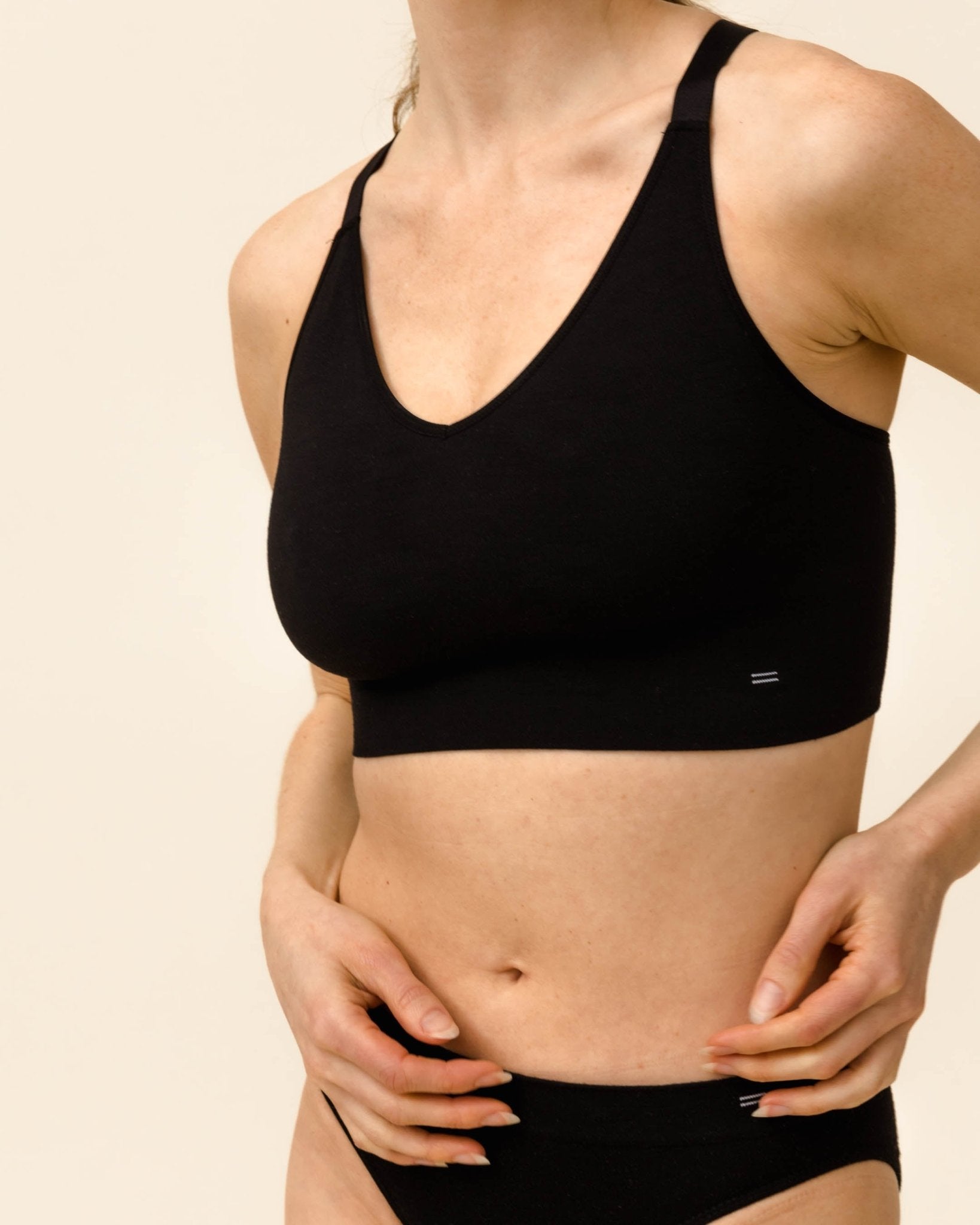Merino underwear set by BRANWYN, woman wearing seamless wool bra and underwear for everyday comfort.