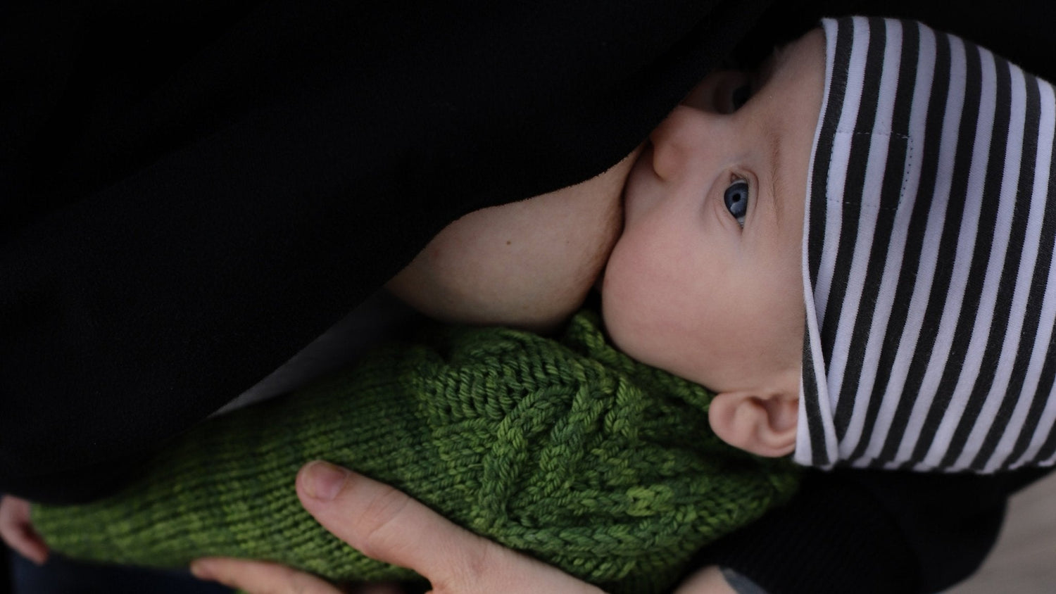 Baby nursing with nursing bra.