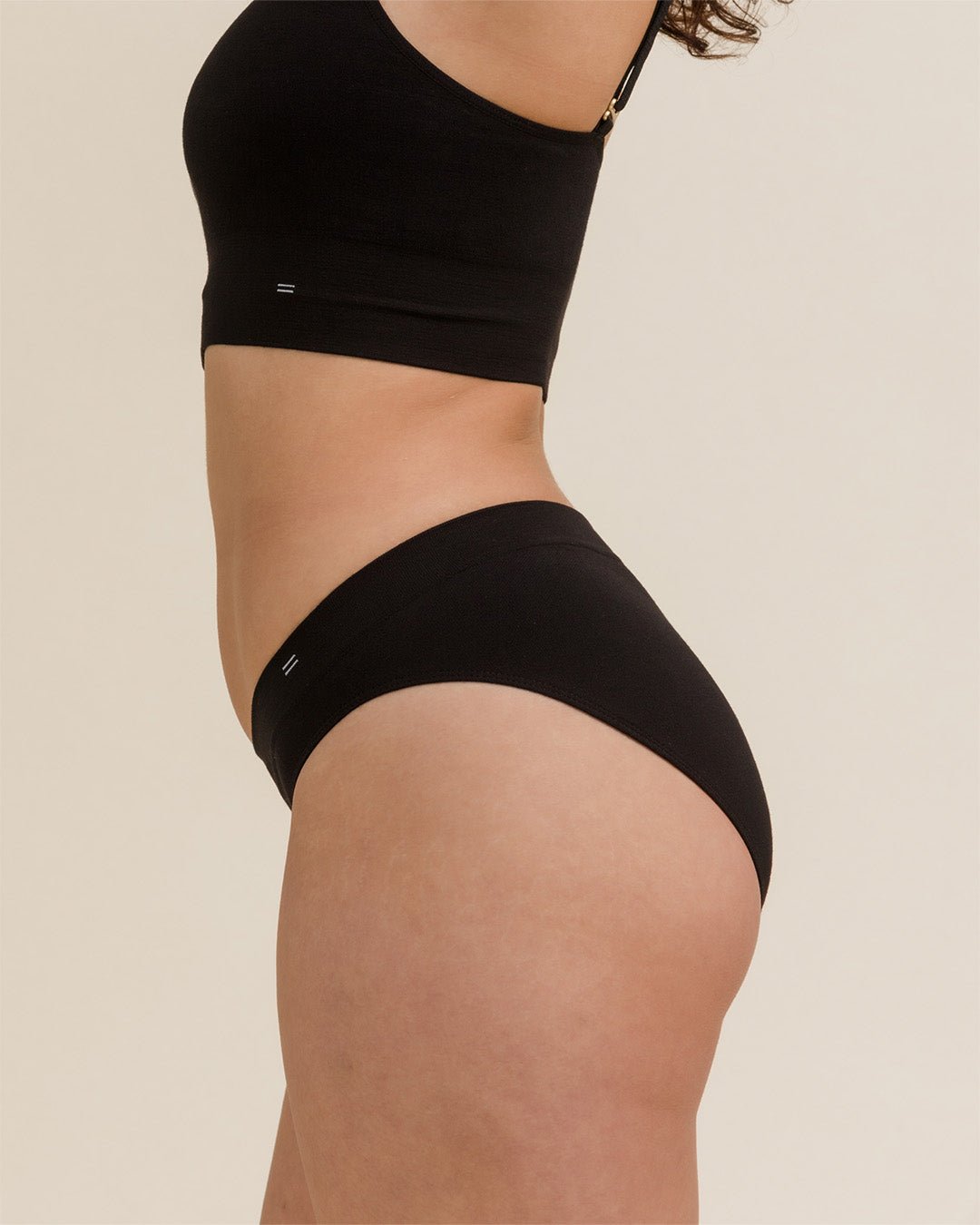 Side view of BRANWYN Essential Bikini Merino underwear in black. Made of natural fabric free from BPAs, PFAs and forever chemicals.