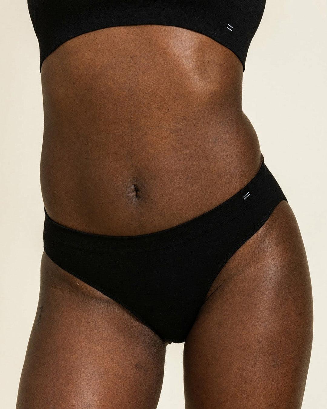 Close up of BRANWYN's black Essential Bikini underwear. Gynecologist approved Merino wool underwear made of natural, sustainable knit fabric.