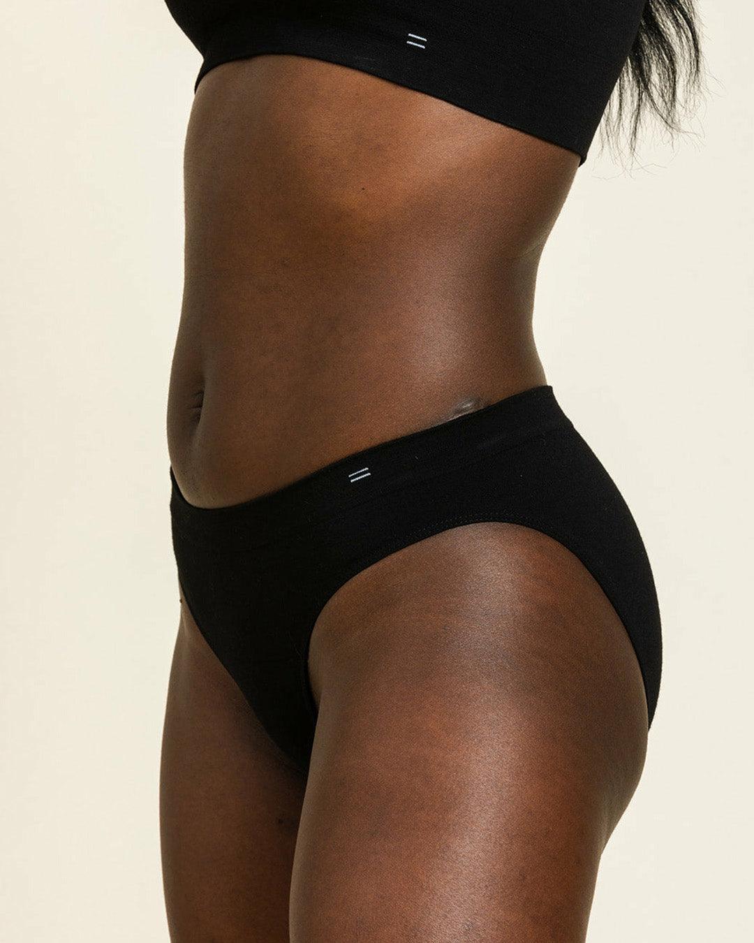 Side view of BRANWYN's Essential Bikini underwear in black. Made of  Merino wool this underwear is odor reducing, easy to wash and perfect for travel.