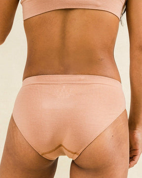 Back view of Merino bikini style underwear in warm nude. BRANWYN's Essential Bikini is made of super soft, knit, seamless Merino wool for ultimate comfort.