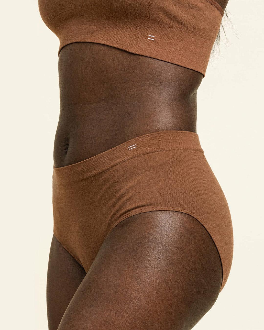 Side profile of BRANWYN dark nude brown Merino Hipster panties, seamless and moisture-wicking for active women.
