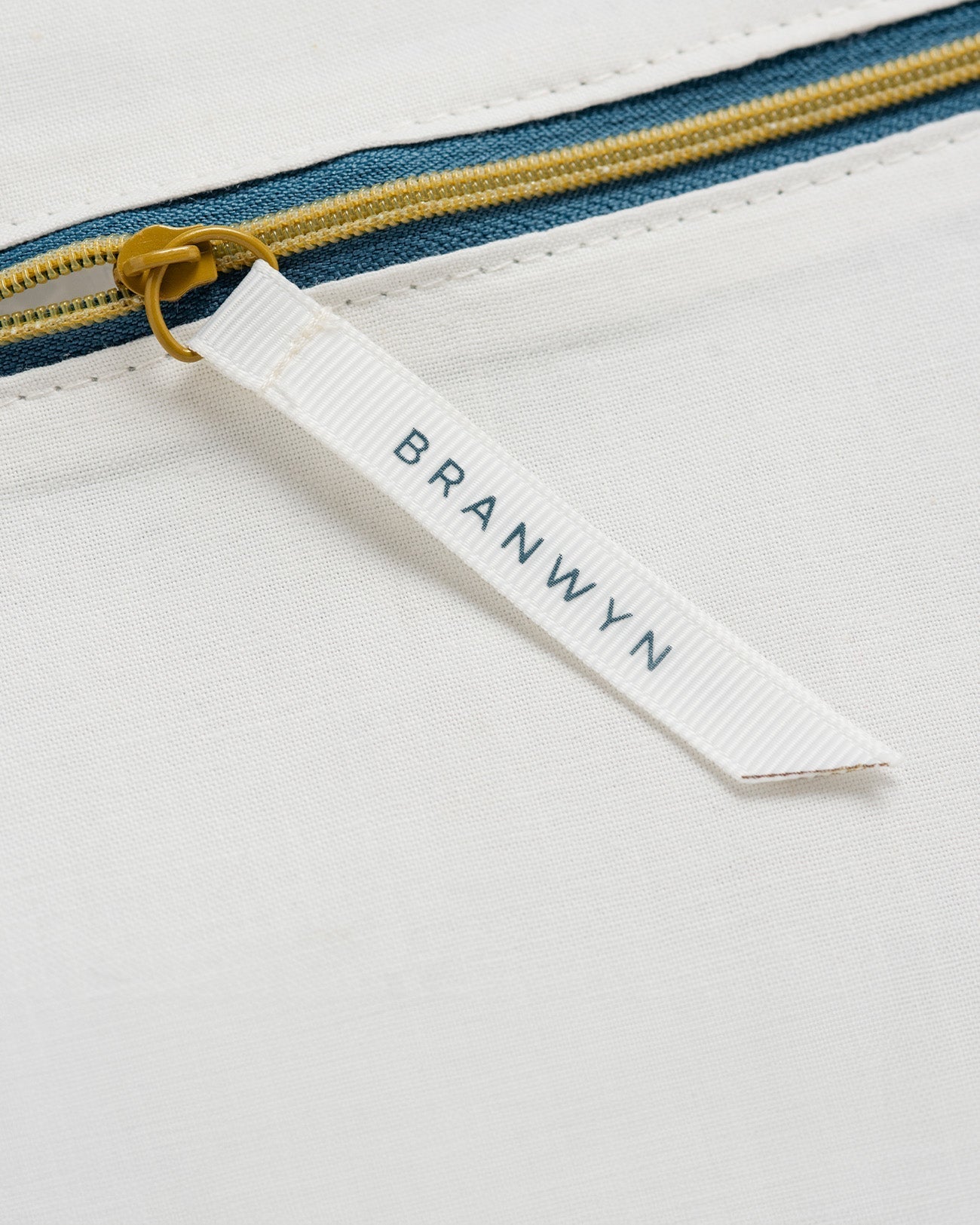 Image shows BRANWYN's Essential Laundry Bag, a GOTS Certified Organic cotton wash bag designed to protect bras and underwear during machine washing. Made from eco-friendly, non-synthetic fabric, it helps prevent snagging, stretching, and damage—prolonging the life of your essentials. Unlike synthetic mesh bags, this organic cotton alternative prevents microplastic pollution, supporting both environmental and social responsibility. A sustainable choice for garment care.