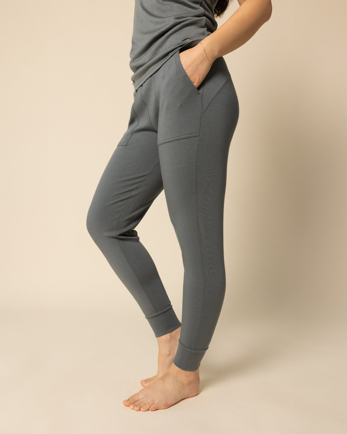 Woman wearing BRANWYN's SWAG 24 | Jogger, a piece from the limited-edition SWAG (Sustainable Wool Athleisure Gear) Collection. Made from ethically sourced, ultra-fine Merino wool, this piece is buttery soft, breathable, and designed for both performance and everyday wear.