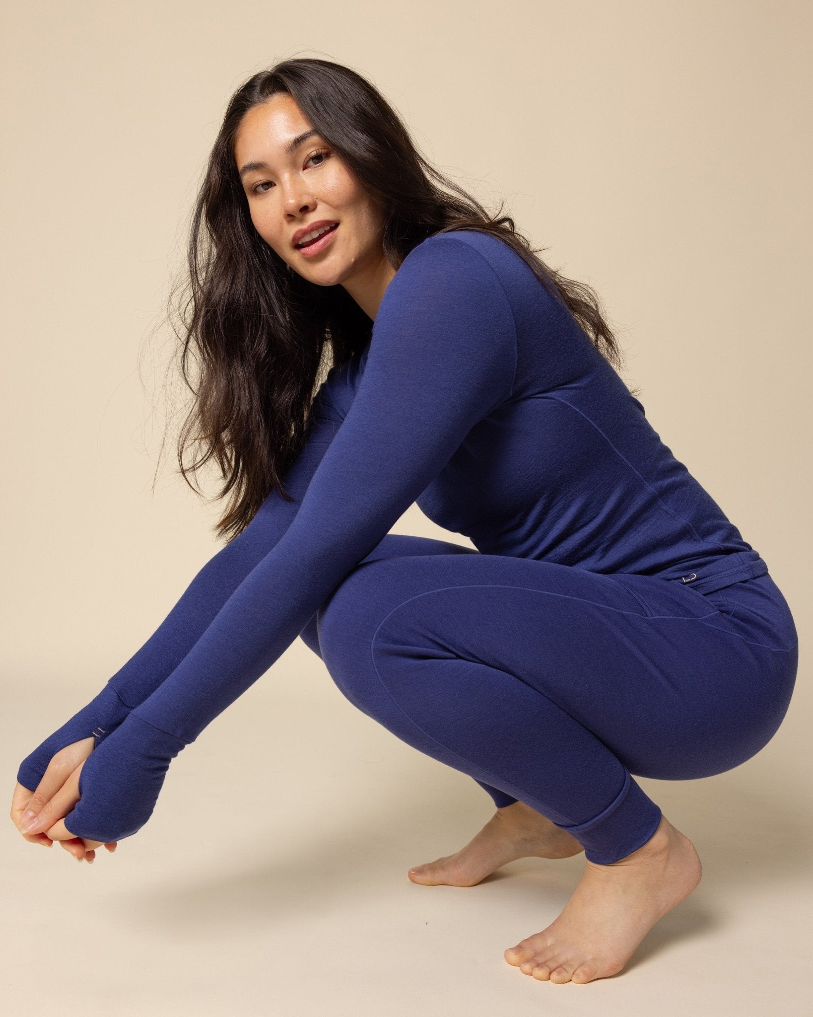 Woman wearing BRANWYN's SWAG 24 | Long Sleeve Tee, a piece from the limited-edition SWAG (Sustainable Wool Athleisure Gear) Collection. Made from ethically sourced, ultra-fine Merino wool, this piece is buttery soft, breathable, and designed for both performance and everyday wear.