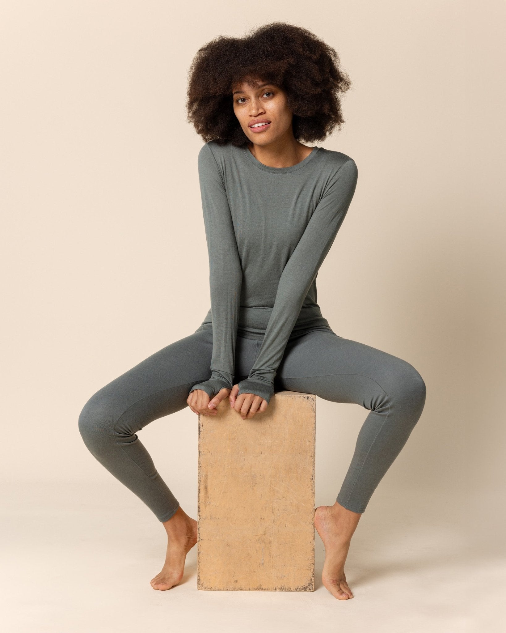 Woman wearing BRANWYN's SWAG 24 | Long Sleeve Tee, a piece from the limited-edition SWAG (Sustainable Wool Athleisure Gear) Collection. Made from ethically sourced, ultra-fine Merino wool, this piece is buttery soft, breathable, and designed for both performance and everyday wear.