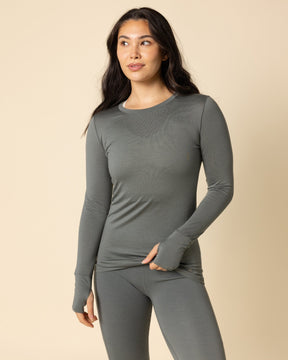 Woman wearing BRANWYN's SWAG 24 | Long Sleeve Tee, a piece from the limited-edition SWAG (Sustainable Wool Athleisure Gear) Collection. Made from ethically sourced, ultra-fine Merino wool, this piece is buttery soft, breathable, and designed for both performance and everyday wear.