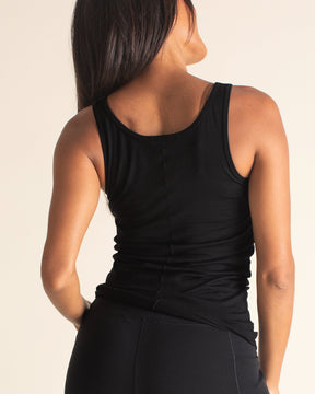 Woman wearing a BRANWYN Women's Merino Wool Black Tank and Black Merino Wool High-waist joggers and leggings Black