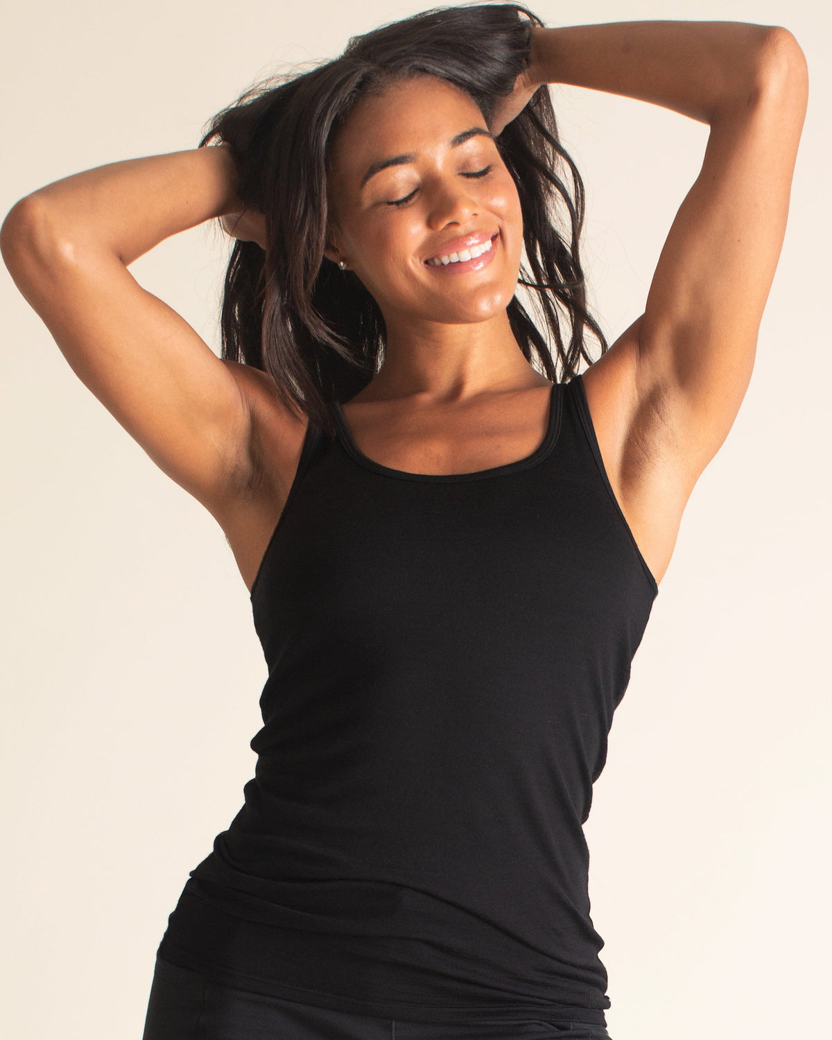 Woman wearing a BRANWYN Women's Merino Wool Black Tank and Black Merino Wool High-waist joggers and leggings Black