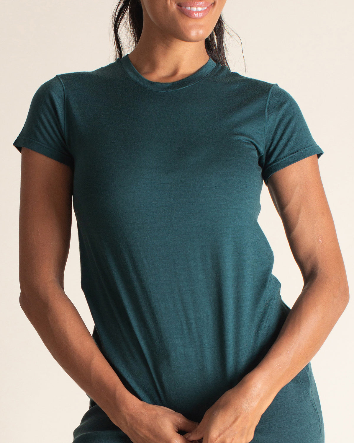 Woman wearing BRANWYN Women's Merino Wool Transformative Teal Short Sleeve Tee 