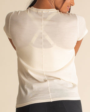 Woman wearing BRANWYN Merino Short Sleeve Tee in Natural White great for Hiking and Yoga