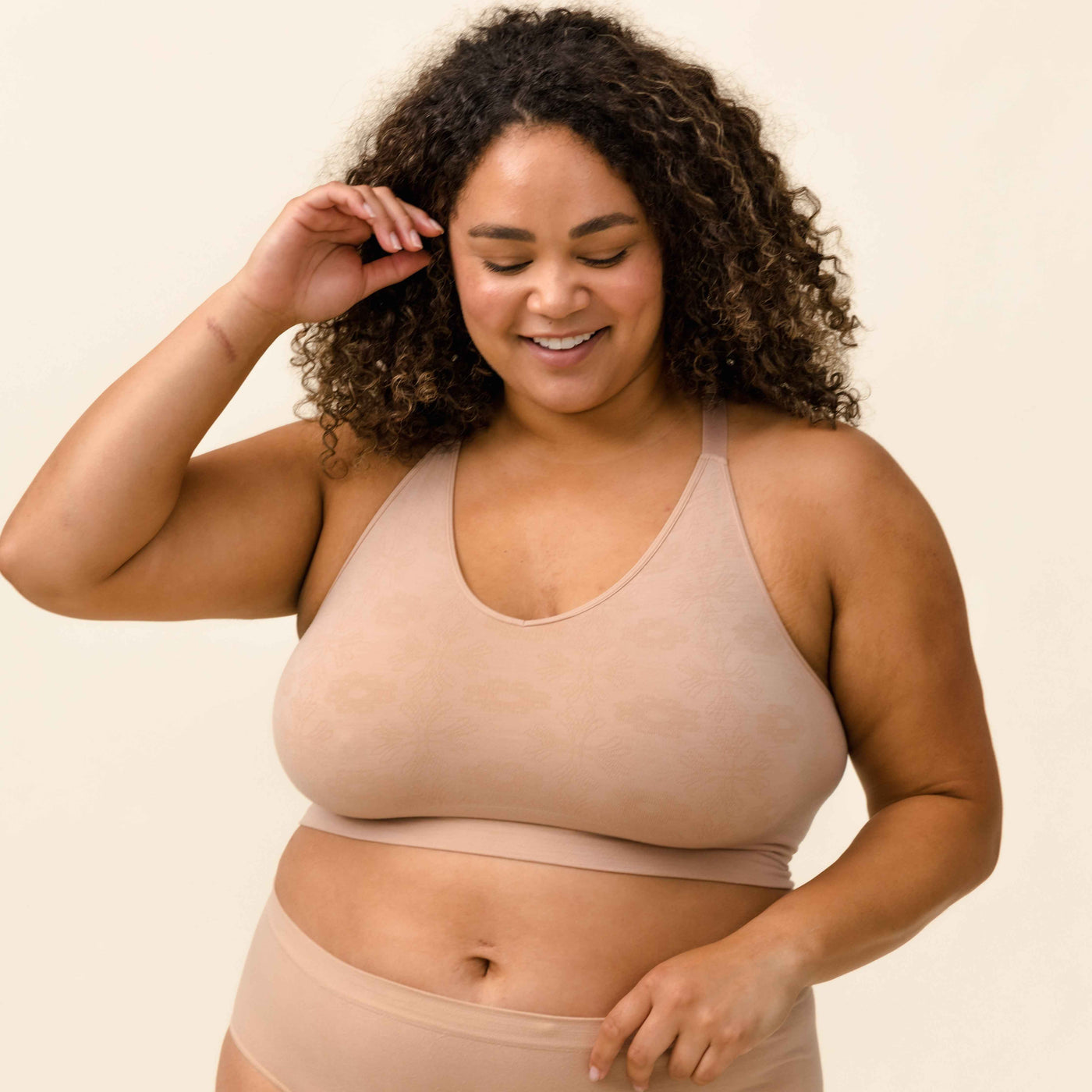 Woman wearing BRANWYN nude Merino wool bra made of natural fibers for sensitive skin and breast pain.