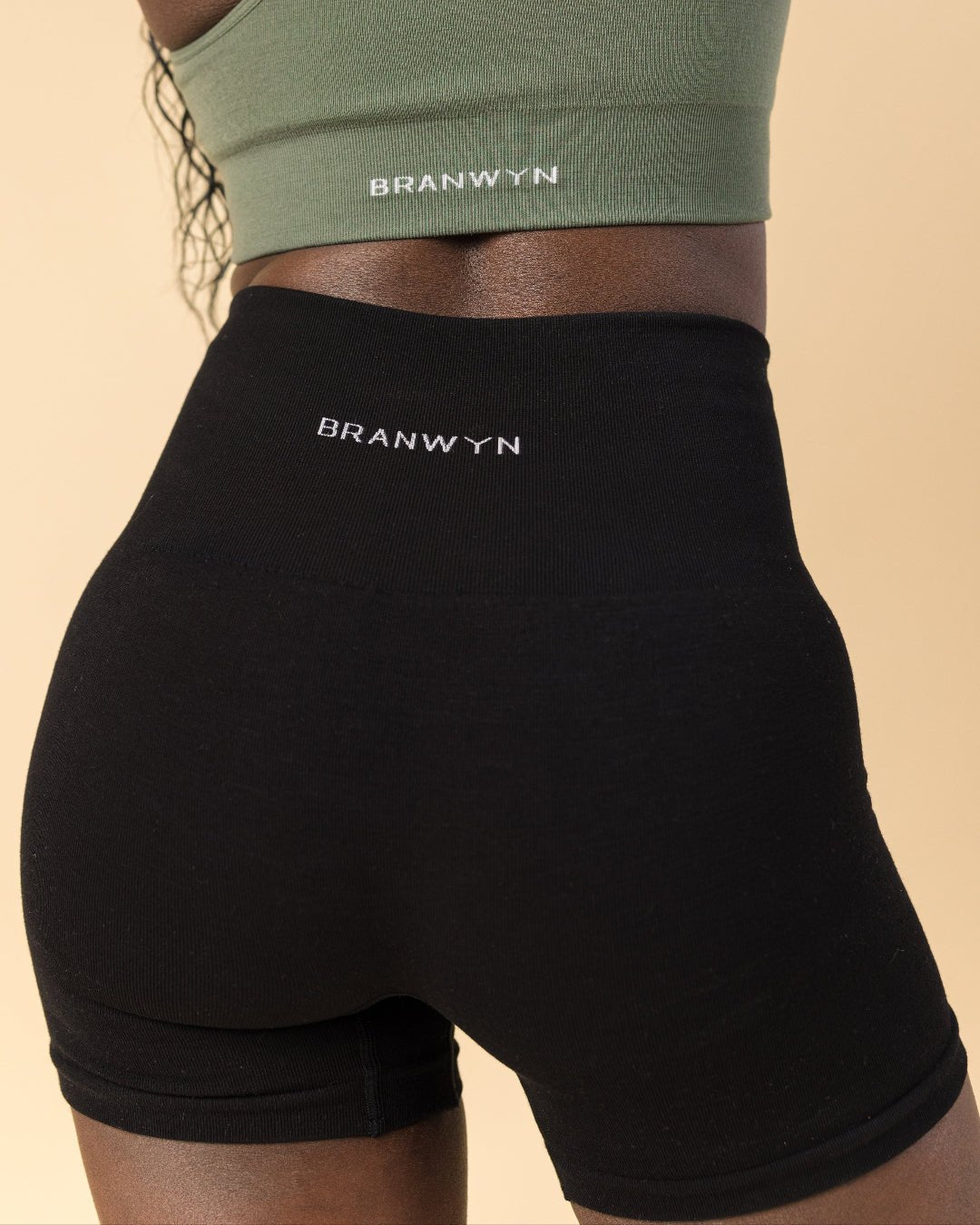 Wearing BRANWYN's Merino sustainable Essential Compressive Short from the back. Merino wool biker short from BRANWYN.