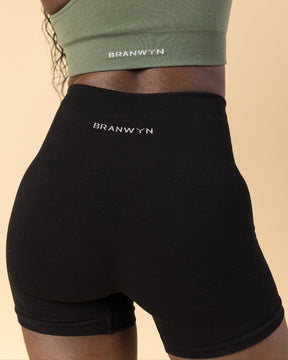 Wearing BRANWYN's Merino sustainable Essential Compressive Short from the back. Merino wool biker short from BRANWYN.