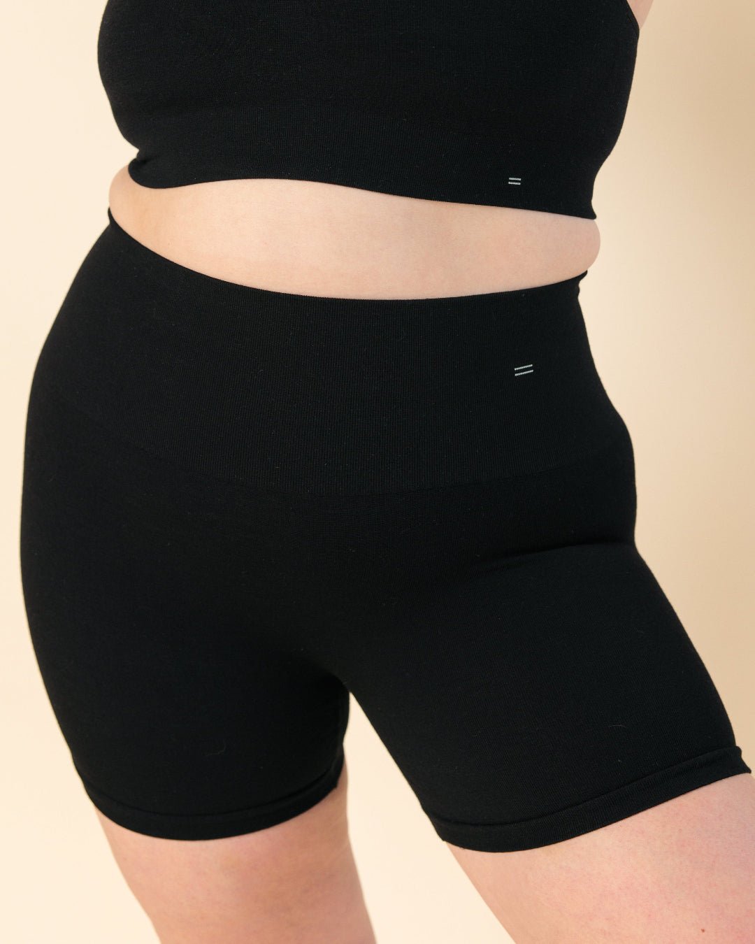 Model wearing Merino wool compression short and matching bra.