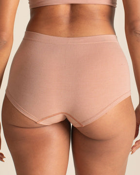 Back view of BRANWYN Essential Boyshort in warm nude. Seamless Merino wool underwear that is breathable, moisture wicking, and odor free.