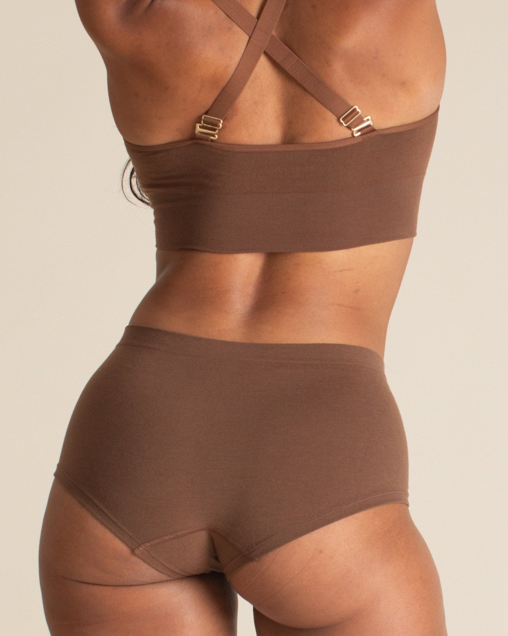 Back view of the Merino wool seamless boyshort in dark nude. This women's boyshort underwear is designed for comfort and made to move with you.
