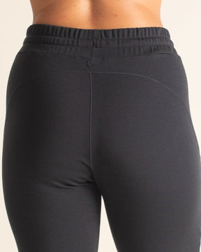 Back view of BRANWYN black Merino wool jogger sweatpants with drawstring waist. Comfortable women’s wool joggers designed for softness, breathability, and everyday wear.