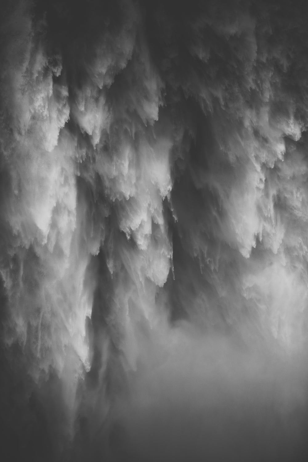 Dramatic slate-gray clouds and drifting mist in monochrome, mood inspiration for the BRANWYN Slate collection