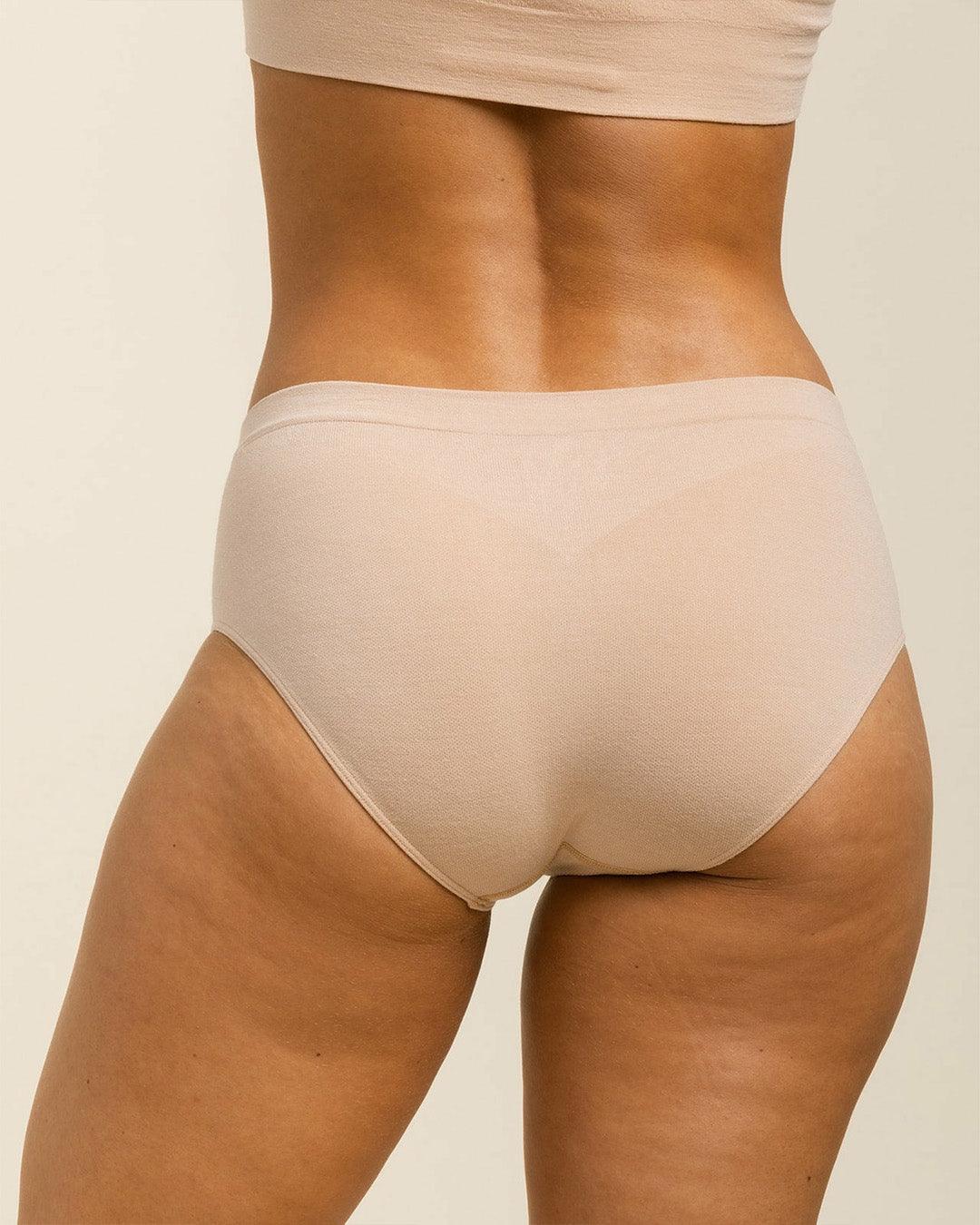 Woman wearing BRANWYN's Essential Hipster, a underwear from the Essential Collection. Made from soft, moisture-wicking Merino wool using seamless technology, this performance innerwear provides performance, comfort, and sustainability. The fabric is free from BPA, PFAS, and forever chemicals.