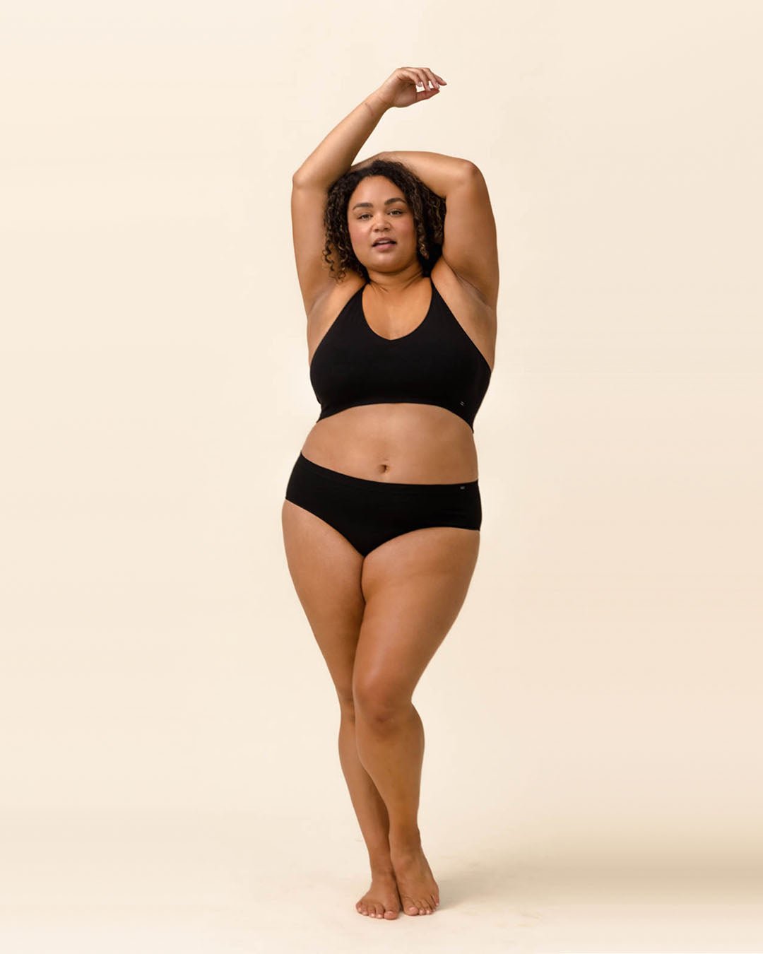 Woman wearing BRANWYN's Essential Hipster, a underwear from the Essential Collection. Made from soft, moisture-wicking Merino wool using seamless technology, this performance innerwear provides performance, comfort, and sustainability. The fabric is free from BPA, PFAS, and forever chemicals.